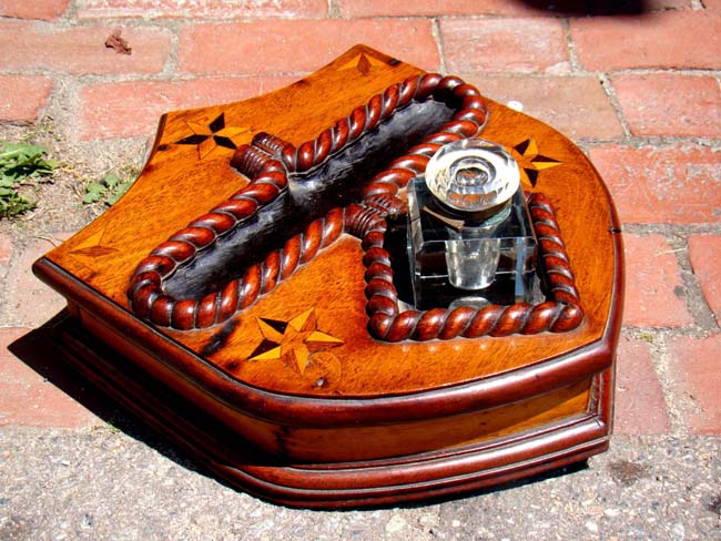 A 19th century Sailor-made one-drawer walnut writing box in the form of a shield circa 1865
